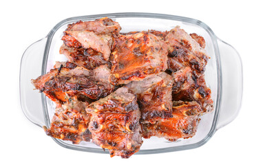 meat fried on coals in a glass cup isolated on a white background.pork ribs.selective focus.