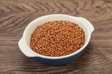 Raw buсkwheat cereal in the bowl