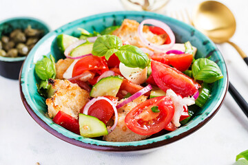 Traditional italian tomato salad panzanella with mozzarella, capers, red onion and croutons. Summer salad. Tuscan salad.