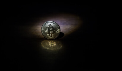 Golden Bitcoin on dark backround. New virtual money. Crypto currency
