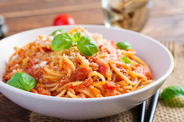 Spaghetti alla Amatriciana with guanciale, tomatoes and pecorino cheese. Italian healthy food.