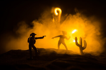 Western cowboy silhouette with texture at sunset and slivers of light