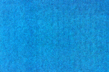 A sheet of blue colored paper. Rough smooth texture.