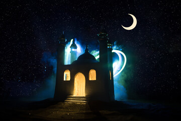 Naklejka premium A realistic Mosque miniature with windows at night. Festive greeting card, invitation for Muslim holy month Ramadan Kareem.
