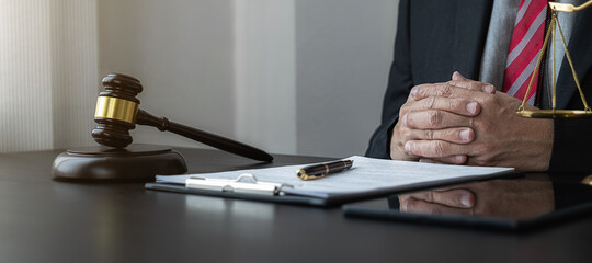 Professional lawyer considering with contract papers in courtroom. Justice, Law, Attorney and Court judge concept.