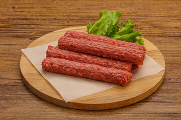 Raw beef sausages with spices