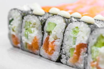 Sushi (a traditional dish of Japanese cuisine) on a white plate