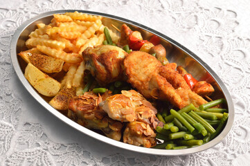Various chicken dishes. Chicken with almonds. BBQ Chicken. Fried Chicken leg  with french fries and roasted potatoes with green beans .
