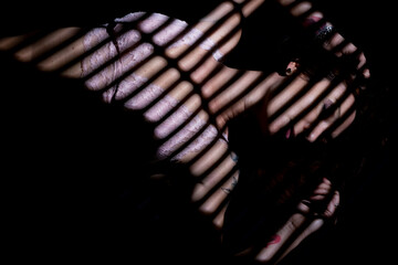 young woman sleeping on black background