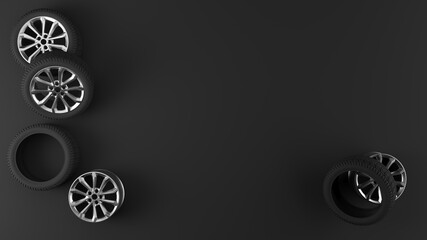 Sports car wheels scattered on the black floor.