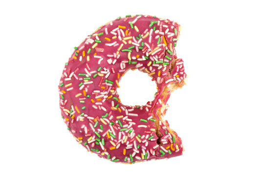 Donut close-up on a white background. Bitten donut isolated on white background.