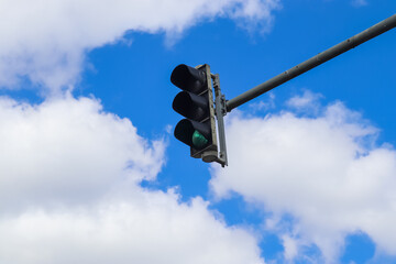 Traffic light against the blue sky