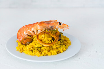 Paella typical spanish food in granite background