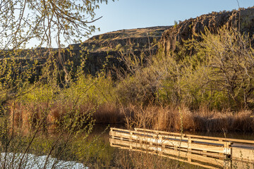 Fototapeta premium Deep Lake Boat Launch Dock Glows at Sunrise in Sun Lakes State Park, Washington