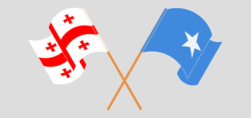 Crossed and waving flags of Georgia and Somalia