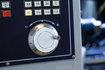 close-up control of the metalworking machine, depth of field, focus blur.