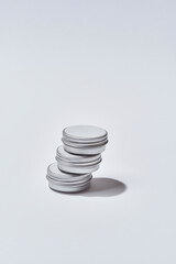 Stack of steel round cans with cosmetological cream