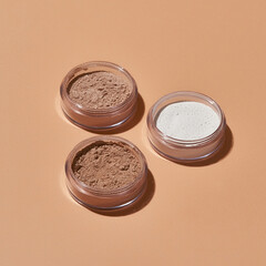 Cosmetological powder in round cans without caps