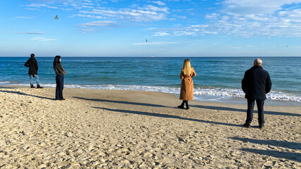 people walking on the beach