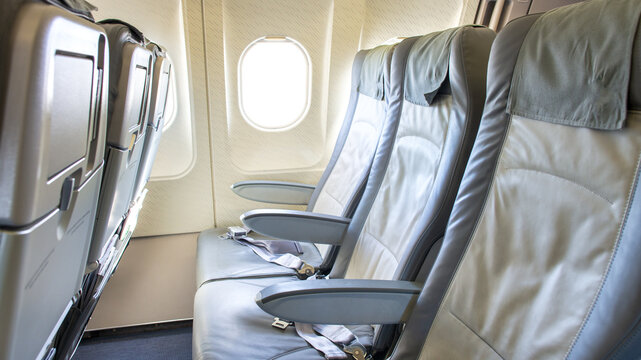 Empty seats of a modern airplane near the window