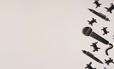 World press freedom day concept. 3 may. A microphone and a pen made of paper, as a symbol of freedom of speech, resist barbed wire and prohibitions. Beige background. Copy space. Banner © Garnar