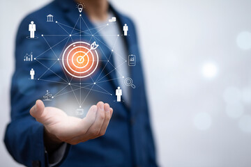 Targeting the business concept, Businessman holding arrow dart to virtual target dart...
