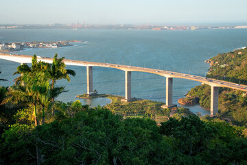 Naklejka premium aerial view of the bridge over the sea and tropical trees