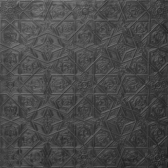 Traditional islamic rhythmic arabesque pattern in form of embossing on metal. Textured black silver backdrop with geometric  intricate relief interlace lines,flowers elements. Decorative chasing art.