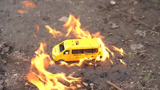 Toy car, yellow bus, taxi lights up.