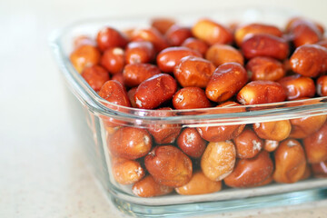 large amount of ripe oleaster fruits, oleaster fruits in a glass bowl,