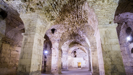 Diocletian's Palace, underground city of Split. Croatia. Bearing walls, columns and arches under the city, remains of the Roman civilization of the historic center of the city. Architectural complex