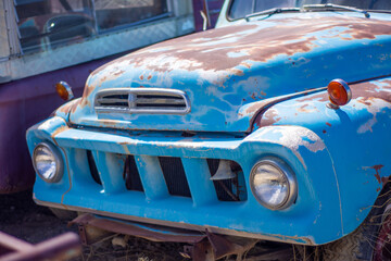 Exterior of vintage retro truck in a junkyard.