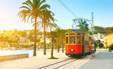 Fototapeta na wymiar The famous orange tram runs from Soller to Port de Soller, Mallorca, Spain