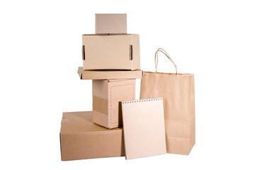 cardboard boxes and package with notebook isolated on white