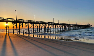 A beautiful sunrise on Topsail Island shows the shadows and reflections of the Seaview Pier.