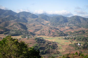 Rolling hills and farm lands with rice fields in Shan state, Myanmar