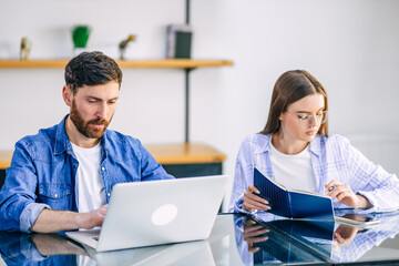 A freelance married couple working from home. A guy and a girl i