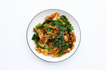 Stir fried flat noodle and pork with soy sauce.