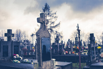 Fototapeta na wymiar Gravestones on the cemetery.Clouds in background.High quality photo.