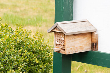Bee nest box in a garden, providing habitat for wild bees