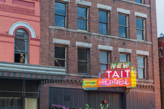 Lighted neon sign for the New Tait Hotel in downtown Butte, Montana, USA - July 30, 2014