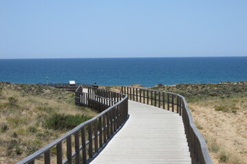 Fototapeta na wymiar walkway to the beach in the sands in Algarve Southern Portugal.