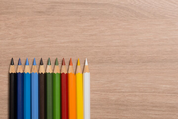 Fototapeta premium pencils on wooden background