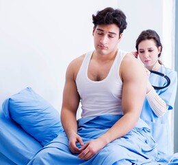 Doctor visiting patient in hospital room