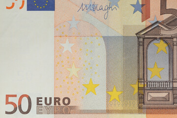 Close-up front part of 50 euro banknote. European currency bill.