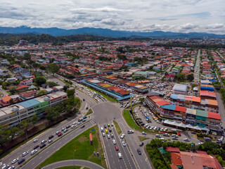 Obraz premium Aerial Drone image of car moving on surrounding Residential area at Kota Kinabalu, Sabah, Malaysia