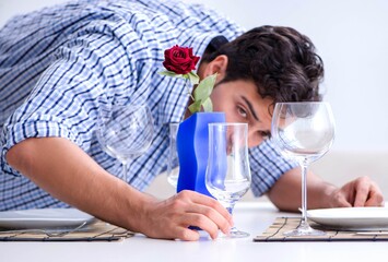 Man alone preparing for romantic date with his sweetheart