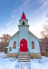 Small white country church with red doors and steeple, Wakefield, Quebec, Canada
