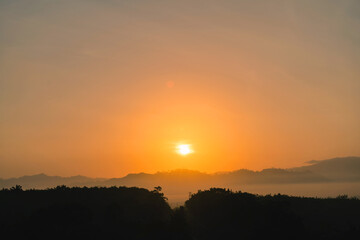 Blue sky background with little clouds, morning sun rising up. In Phuket, Thailand