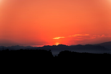 Blue sky background with little clouds, morning sun rising up. In Phuket, Thailand